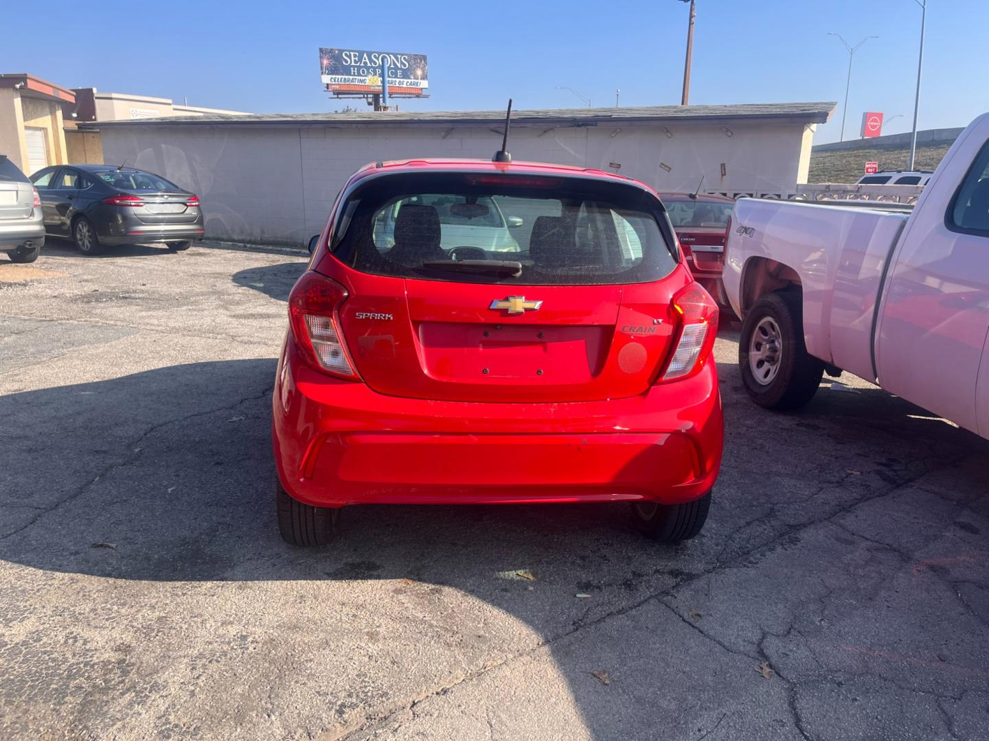 2017 RED CHEVROLET SPARK 1LT 1LT CVT (KL8CD6SA9HC) with an 1.4L L4 16V DOHC engine, CVT transmission, located at 8101 E. Skelly Dr., Tulsa, OK, 74129, (918) 592-3593, 36.121891, -95.888802 - Photo#2